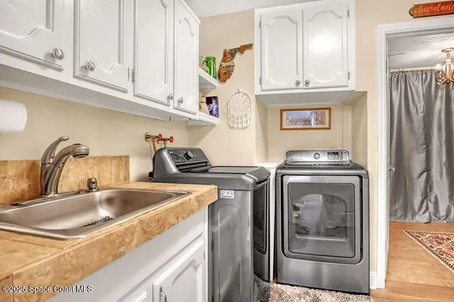 a bedroom with a large bed couch and a window