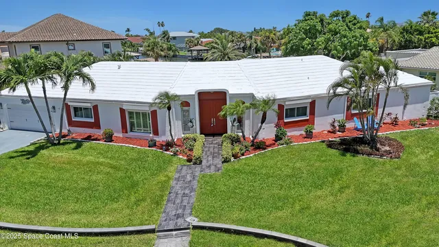 a view of a house with backyard porch and sitting area