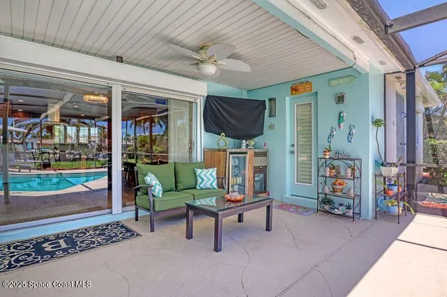 a view of a house with a backyard porch and sitting area
