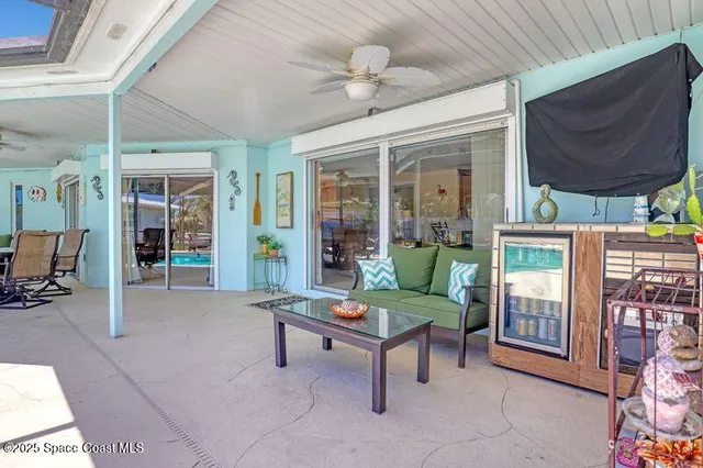 a view of a house with a backyard porch and sitting area