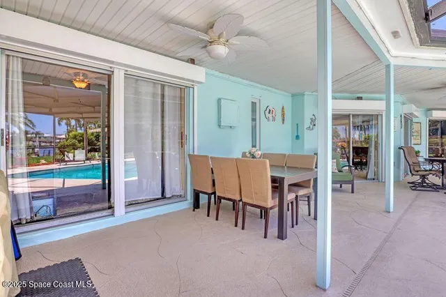 a view of house with outdoor seating and a patio