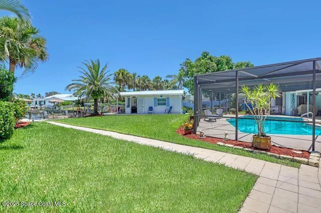 a view of a patio with chairs and a table of the patio