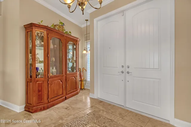 a view of a dining room with furniture wooden floor and chandelier