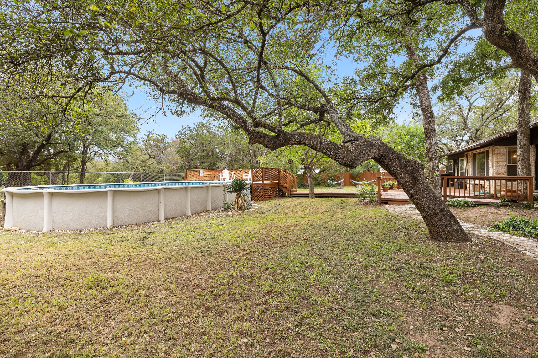 136 Valley View Road Georgetown, TX 78633 - Photo 32 of 40 The portion of the backyard that includes the pool is fenced separately from the rear acreage. This is a very nice feature!