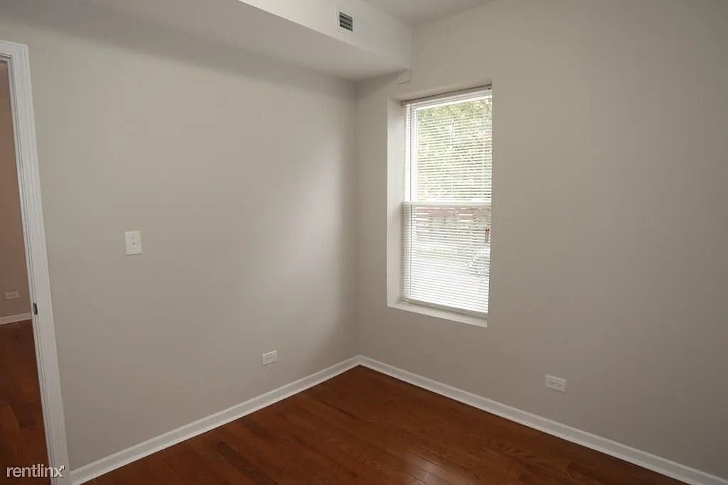3916 West Altgeld Street, Unit 1 Chicago, IL 60647 - Photo 14 of 18 an empty room with a window