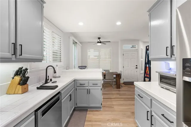 a kitchen with a sink stove and cabinets