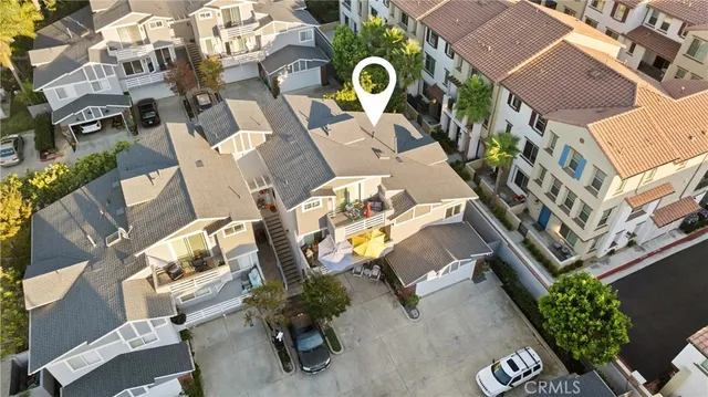 an aerial view of residential house with outdoor space and parking