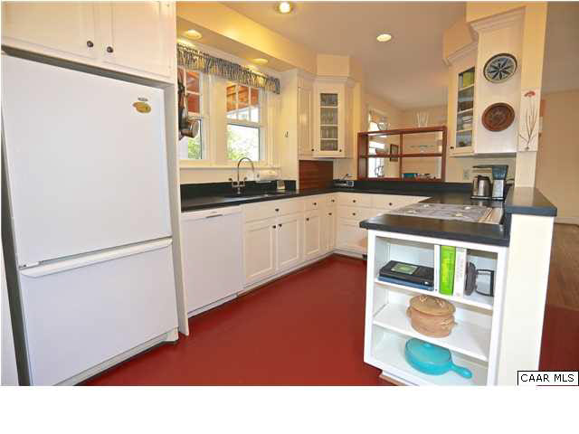 1806 Rugby Place Charlottesville, VA 22903 - Photo 11 of 34 a open kitchen with stainless steel appliances granite countertop a refrigerator a sink and a stove with wooden floor