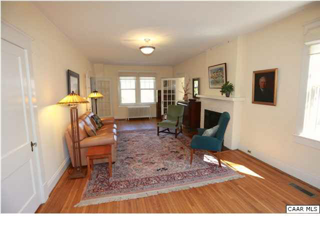 1806 Rugby Place Charlottesville, VA 22903 - Photo 8 of 34 a living room with furniture a flat screen tv and a window