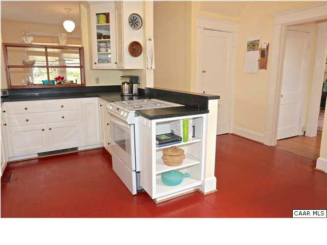 1806 Rugby Place Charlottesville, VA 22903 - Photo 10 of 34 a kitchen with kitchen island a stove a sink and a window