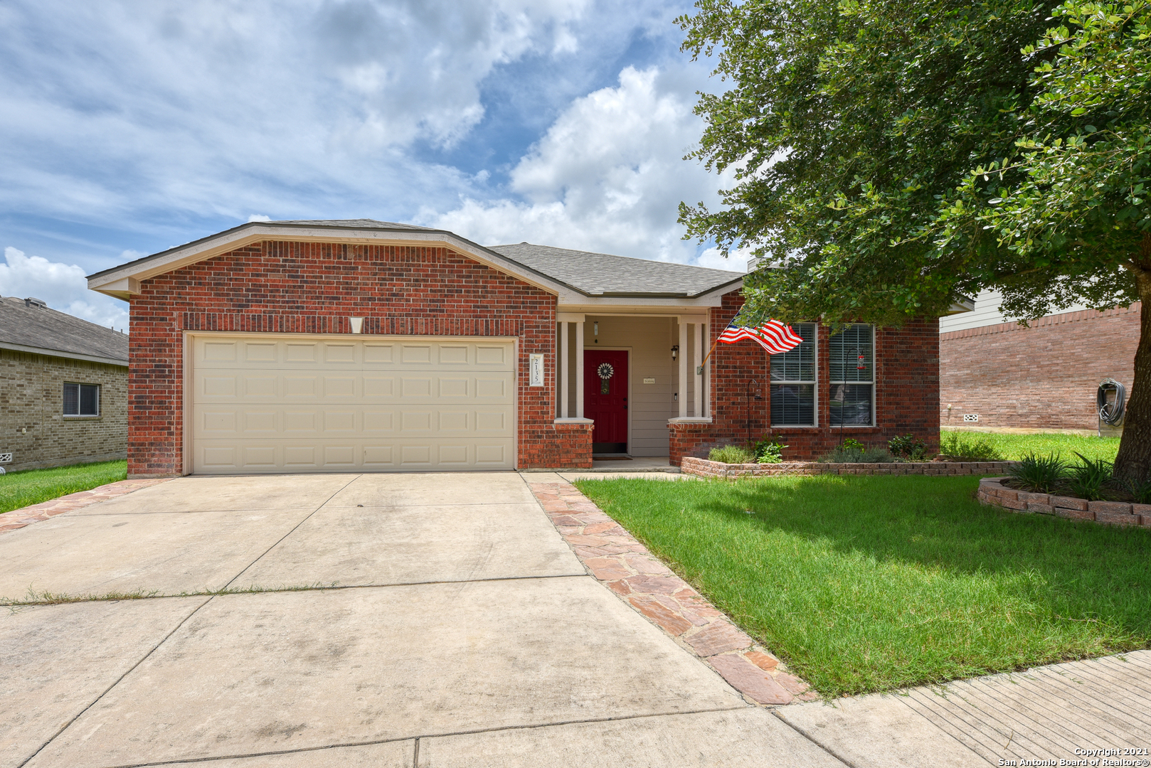 a front view of a house with a yard
