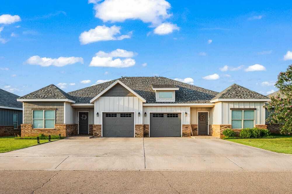 2510 112th Street, Unit A Lubbock, TX 79423 - Photo 1 of 41 a front view of a house with a garden