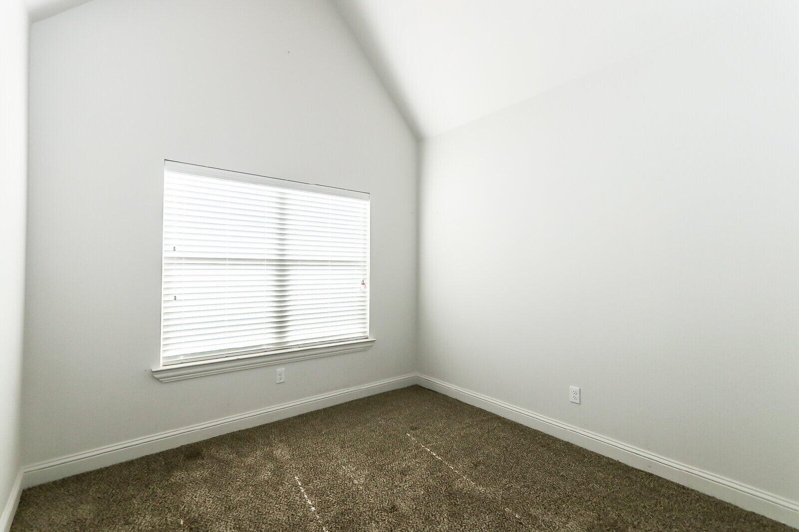 2510 112th Street, Unit A Lubbock, TX 79423 - Photo 22 of 41 an empty room with a window