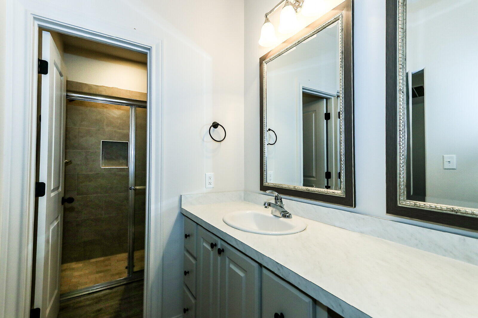 2510 112th Street, Unit A Lubbock, TX 79423 - Photo 23 of 41 a bathroom with a sink and a mirror