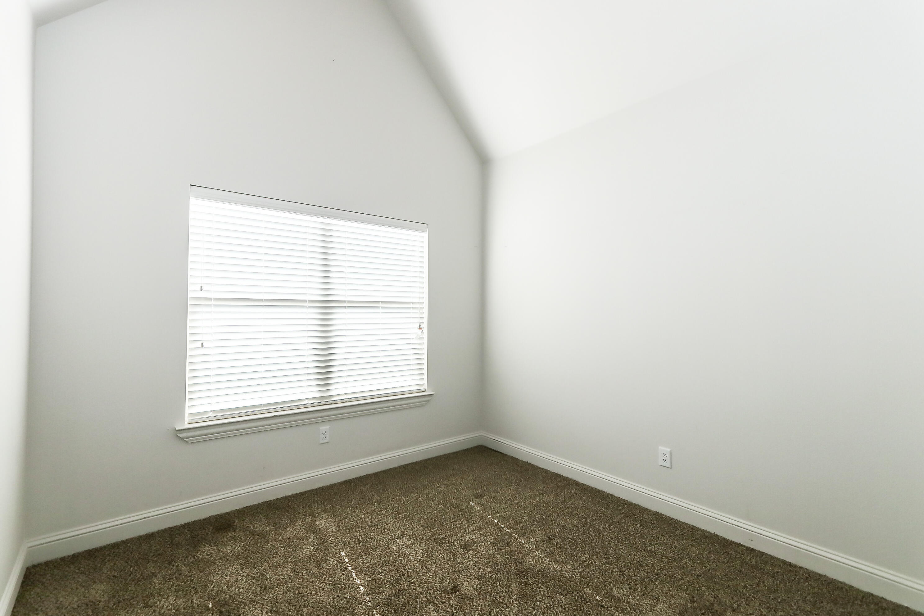 2510 112th Street, Unit A Lubbock, TX 79423 - Photo 39 of 41 an empty room with a window