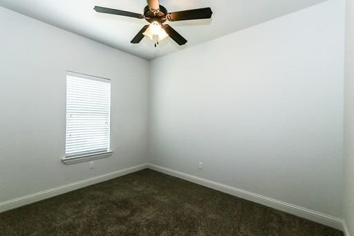 2510 112th Street, Unit A Lubbock, TX 79423 - Photo 10 of 41 an empty room with a window and a fan