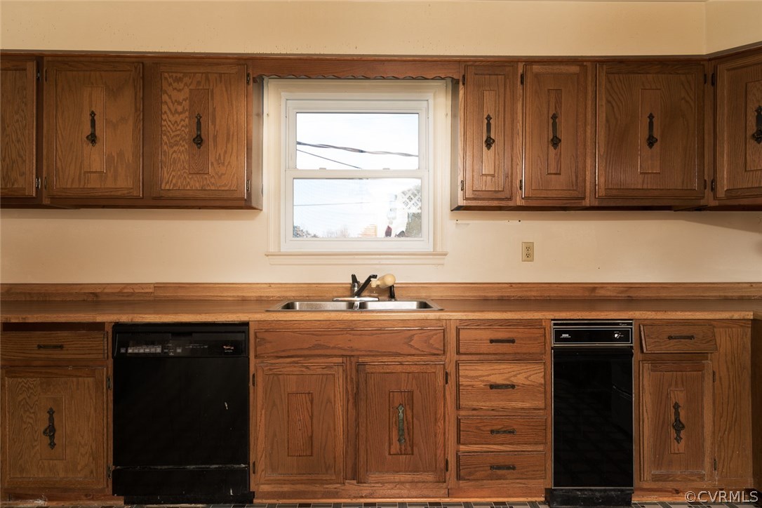 11413 Reedy Branch Road Chesterfield, VA 23838 - Photo 13 of 25 a kitchen with granite countertop a sink cabinets and a wooden floor