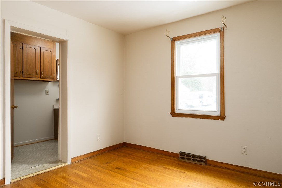 11413 Reedy Branch Road Chesterfield, VA 23838 - Photo 16 of 25 wooden floor in an empty room with a window