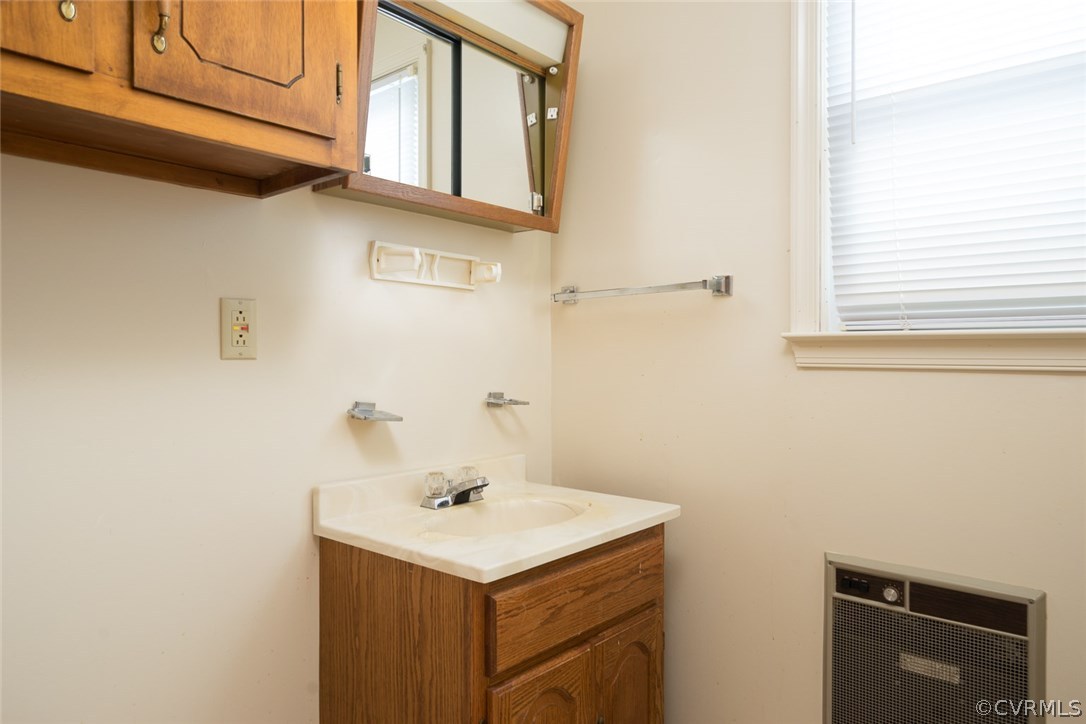 11413 Reedy Branch Road Chesterfield, VA 23838 - Photo 17 of 25 a bathroom with a sink and a mirror