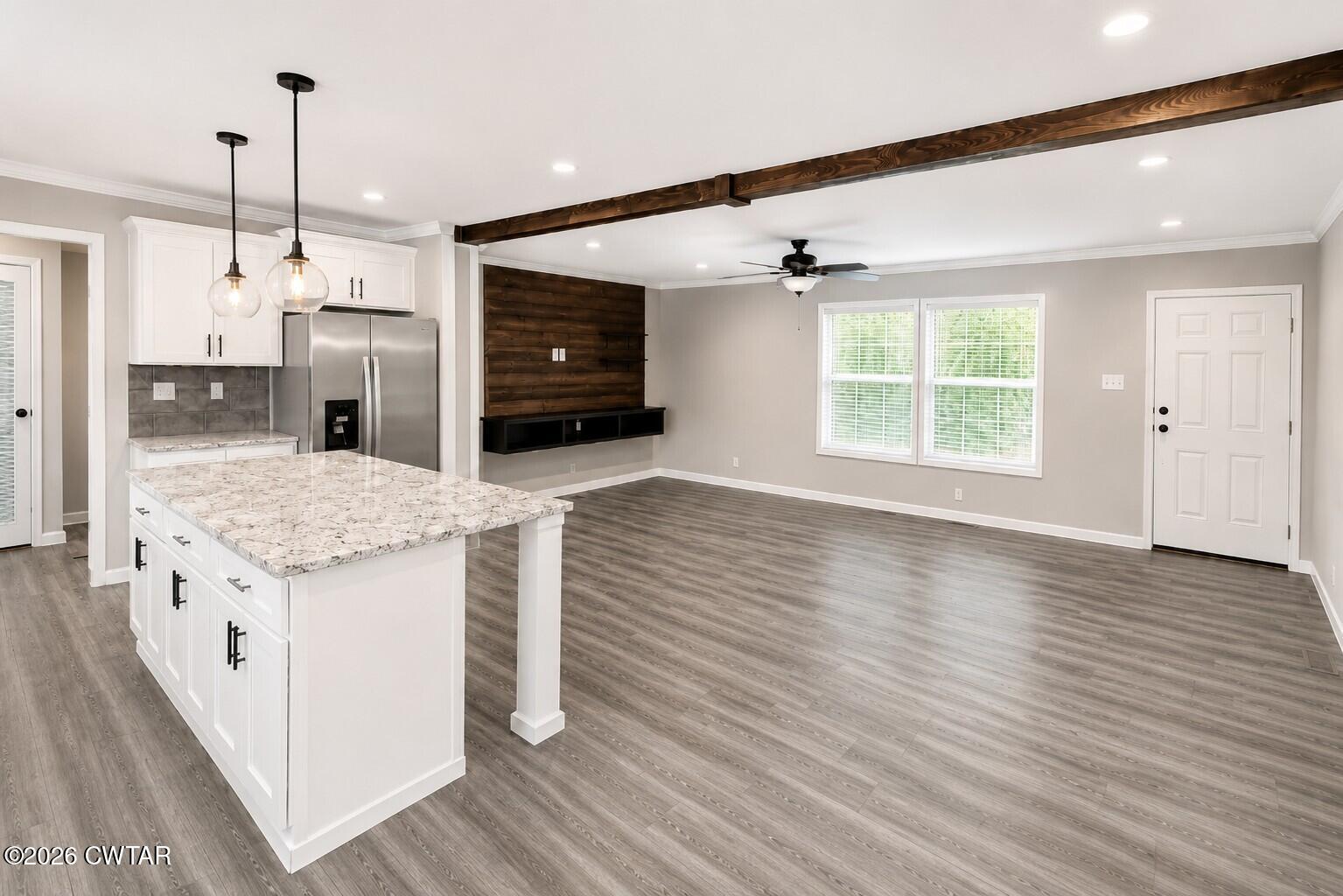 398 Pope Road Lexington, TN 38351 - Photo 9 of 21 a kitchen with a stove and a wooden floor