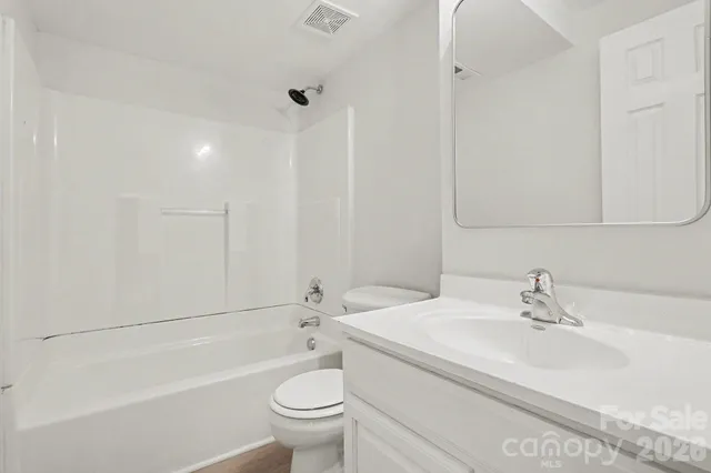 a bathroom with a sink a toilet and a bathtub