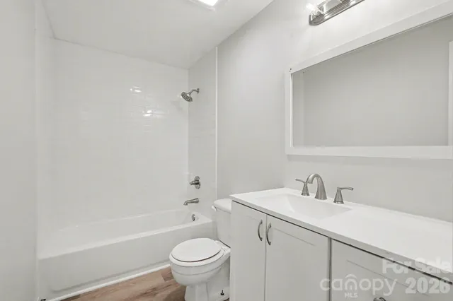a bathroom with a sink a toilet and a bathtub