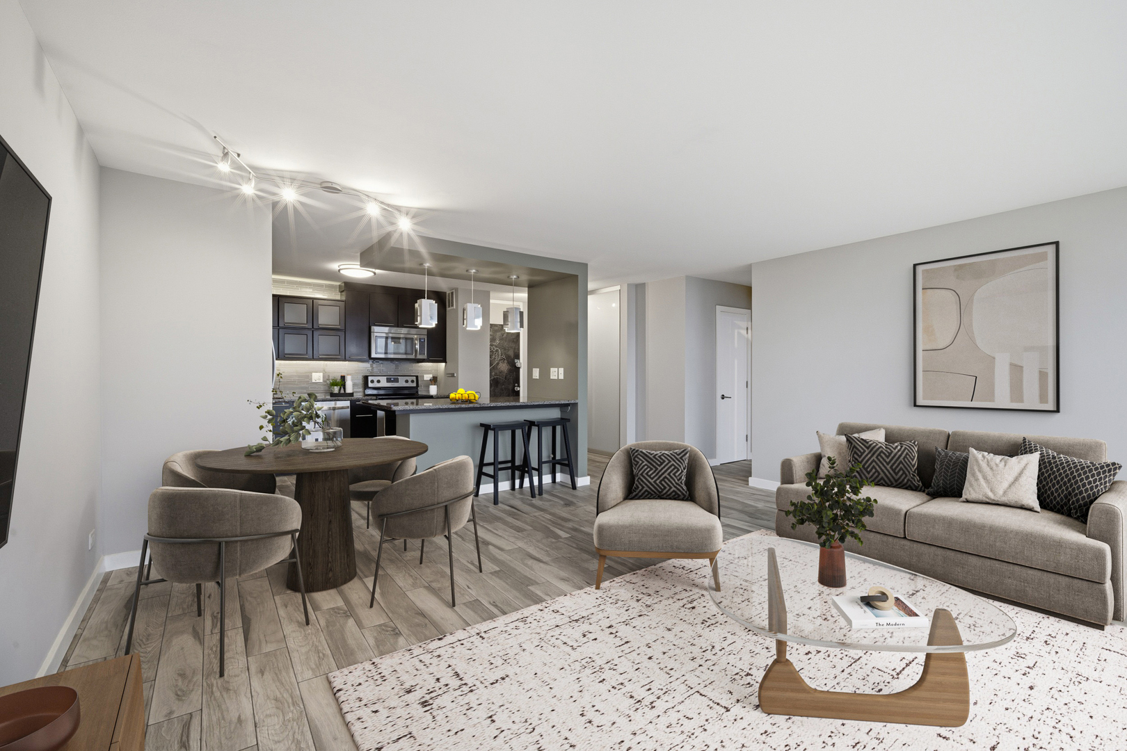 5455 North Sheridan Road, Unit 2611 Chicago, IL 60640 - Photo 12 of 26 a living room with furniture kitchen view and a table