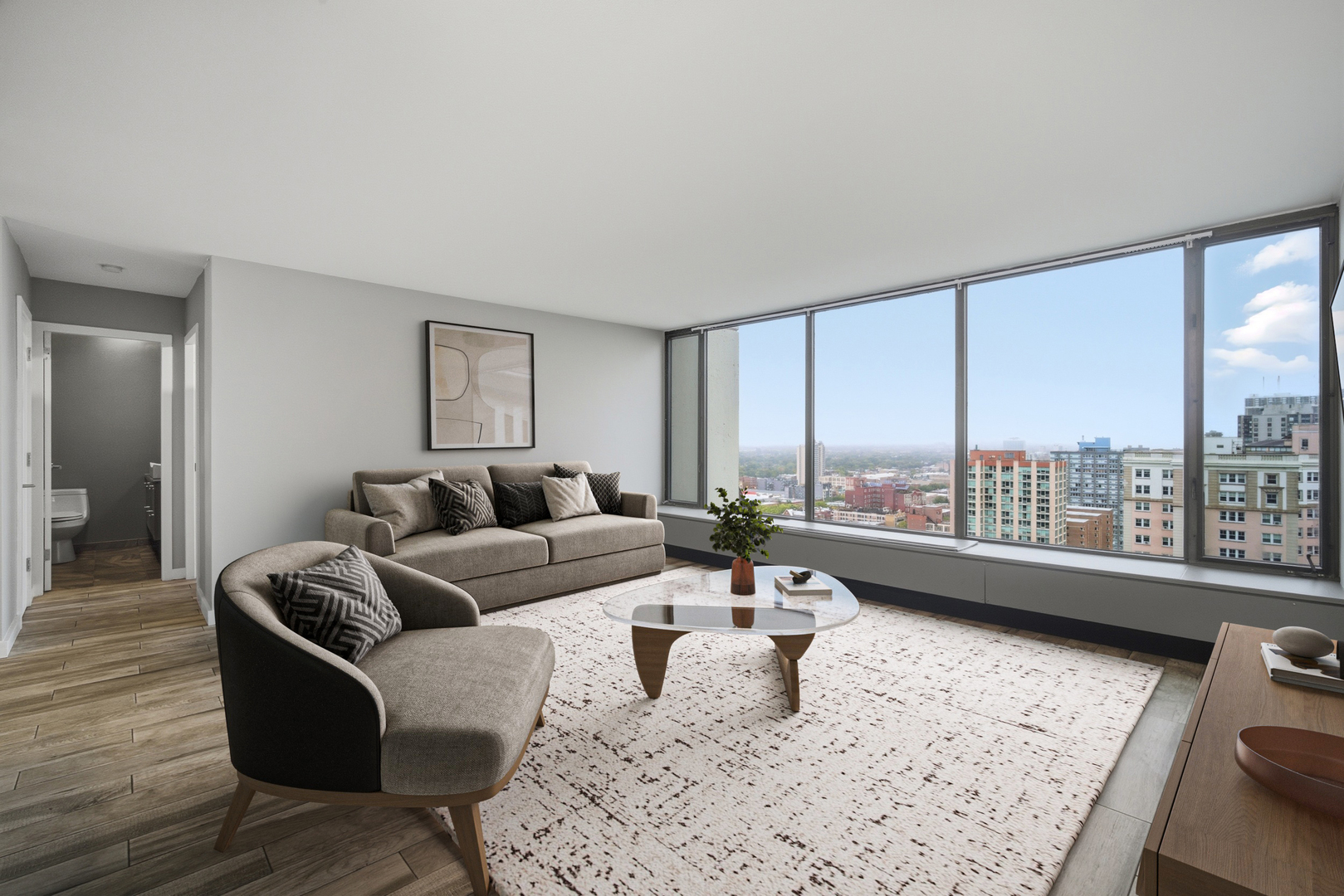 5455 North Sheridan Road, Unit 2611 Chicago, IL 60640 - Photo 14 of 26 a living room with furniture and a large window