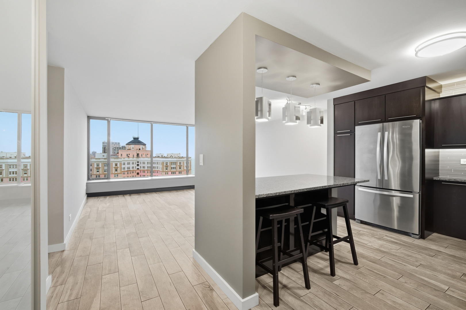 5455 North Sheridan Road, Unit 2611 Chicago, IL 60640 - Photo 4 of 26 a kitchen with stainless steel appliances a refrigerator and a stove top oven