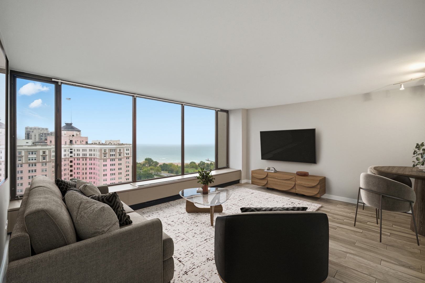 5455 North Sheridan Road, Unit 2611 Chicago, IL 60640 - Photo 8 of 26 a living room with furniture and a flat screen tv