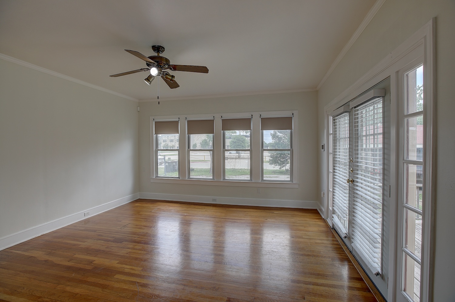 1708 Olive Street Georgetown, TX 78626 - Photo 13 of 40 a view of empty room with wooden floor and fan