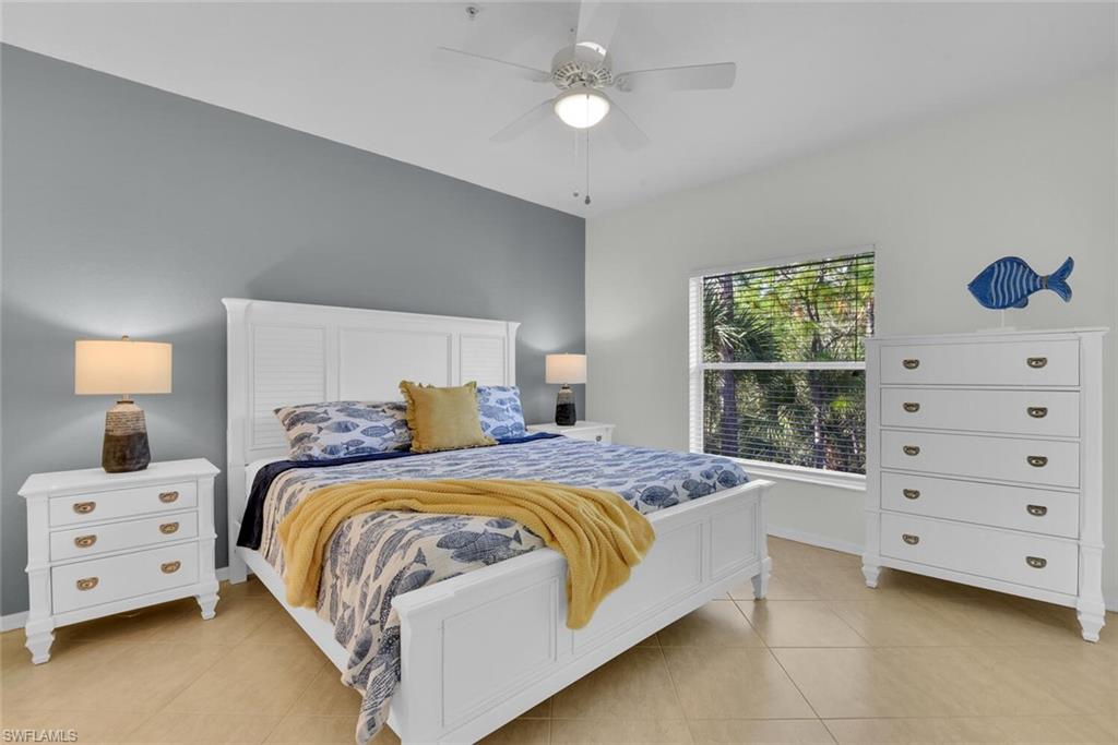 9165 Celeste Drive, Unit 3303 Naples, FL 34113 - Photo 12 of 26 a bedroom with a bed and a window