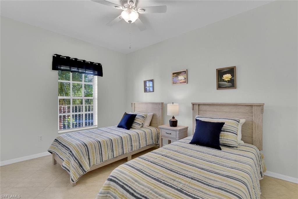 9165 Celeste Drive, Unit 3303 Naples, FL 34113 - Photo 15 of 26 a bedroom with bed and window