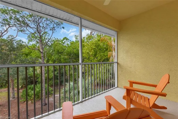 a balcony view with a seating space