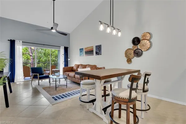 a kitchen with a table and chairs in it