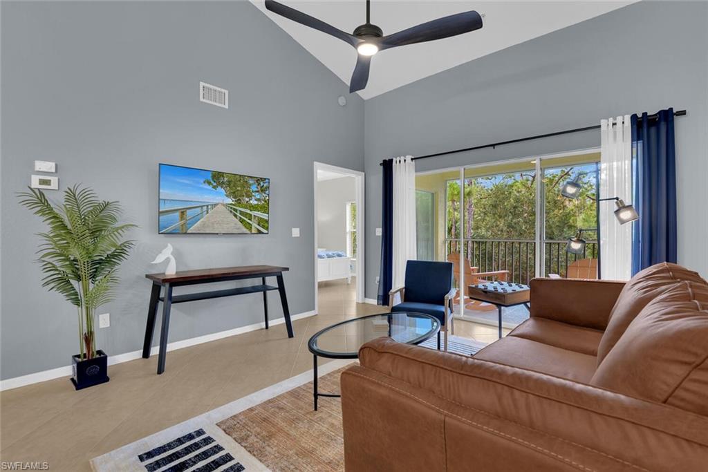 9165 Celeste Drive, Unit 3303 Naples, FL 34113 - Photo 10 of 26 a living room with furniture and a potted plant