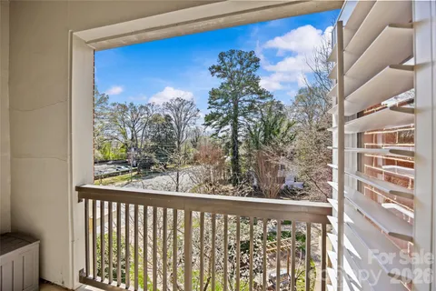 a view of a balcony with a trees