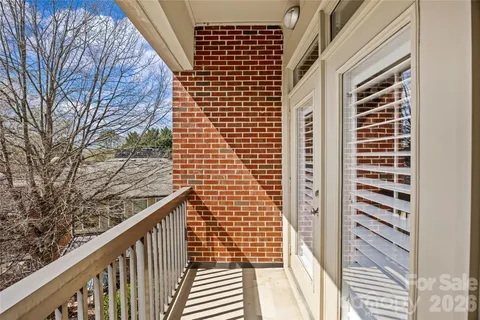 a view of balcony with wooden floor