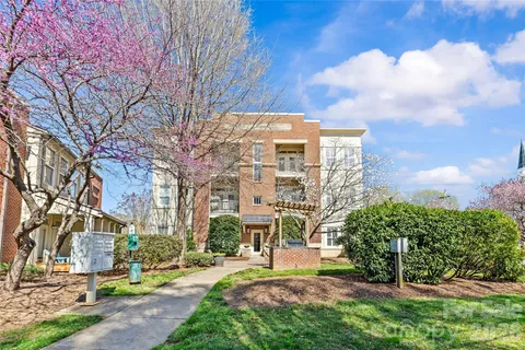 a view of a building with a yard