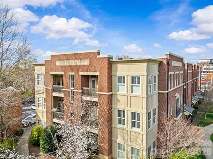 a view of a large building with a yard