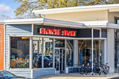a view of a street with sitting area