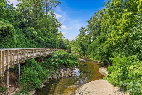 a balcony with lots of green space
