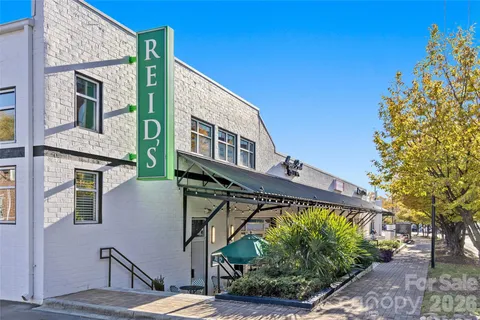 a view of a building with a tree