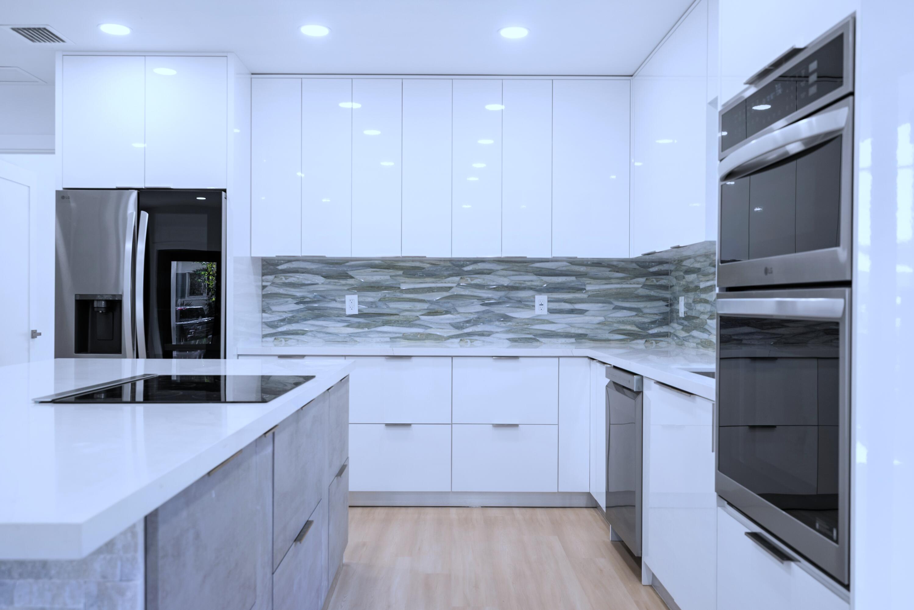 17 Coral Way Key Largo, FL 33037 - Photo 14 of 51 a kitchen that has a sink and a stove in it