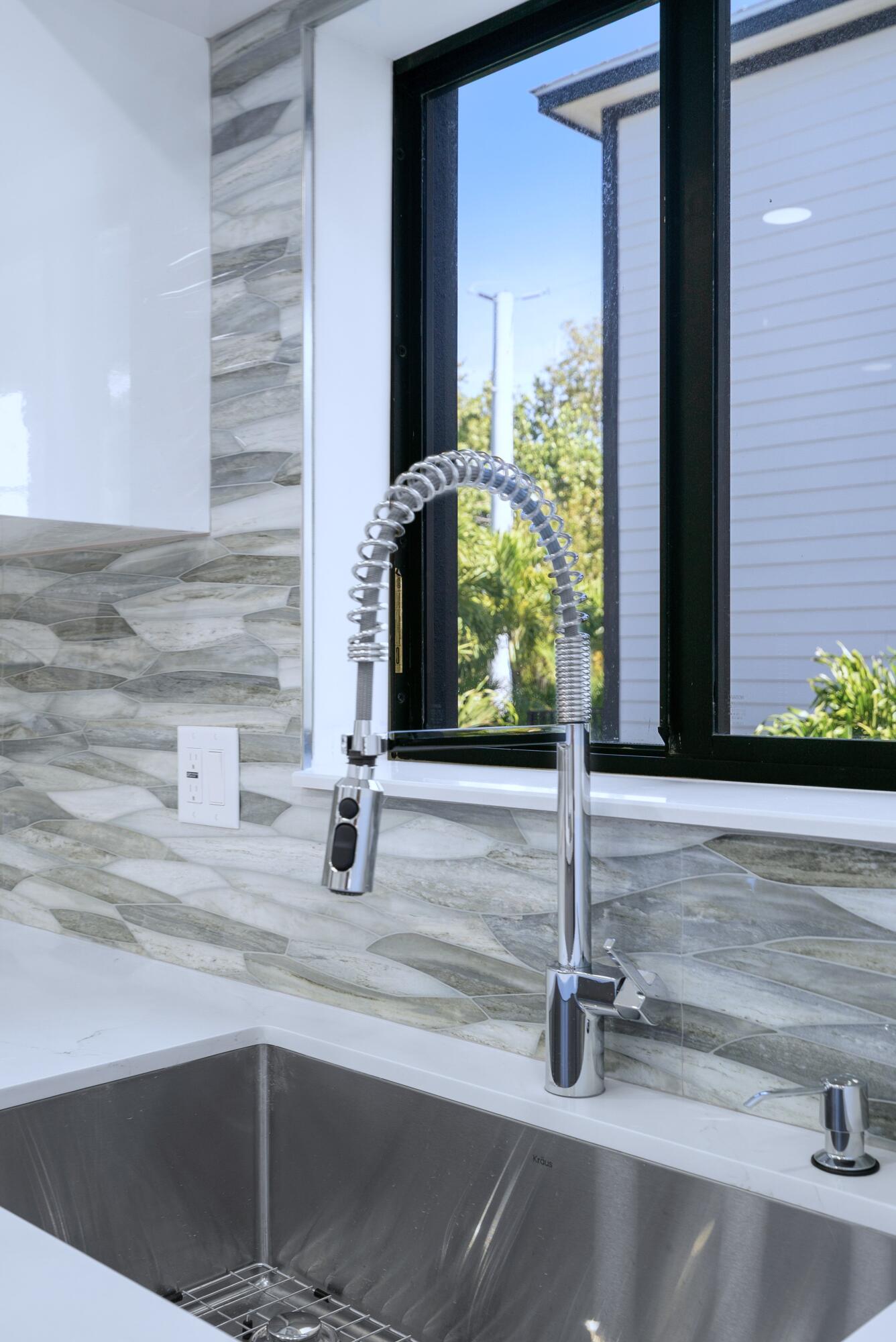 17 Coral Way Key Largo, FL 33037 - Photo 16 of 51 a kitchen with a sink and a window