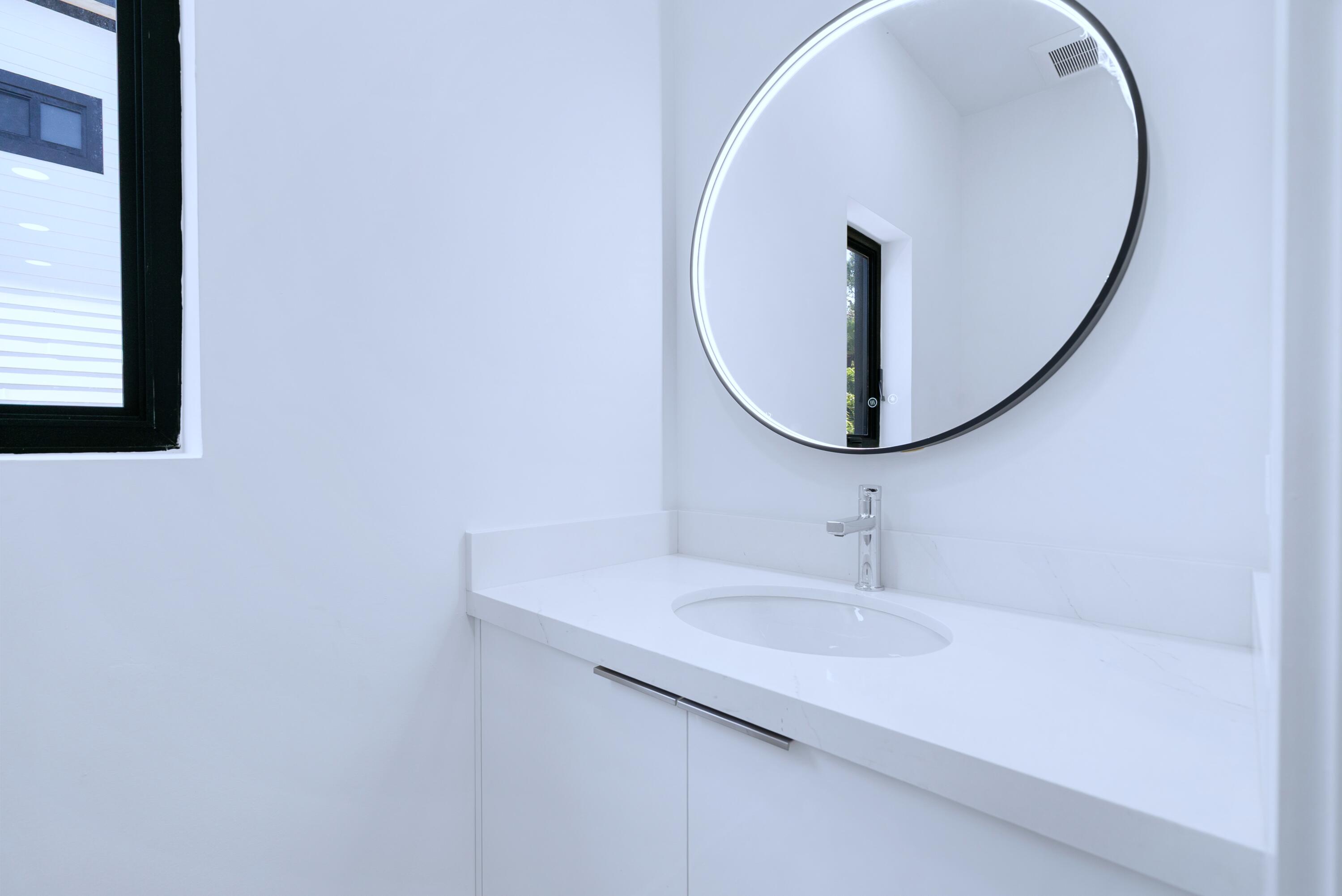 17 Coral Way Key Largo, FL 33037 - Photo 22 of 51 a bathroom with a sink and a mirror