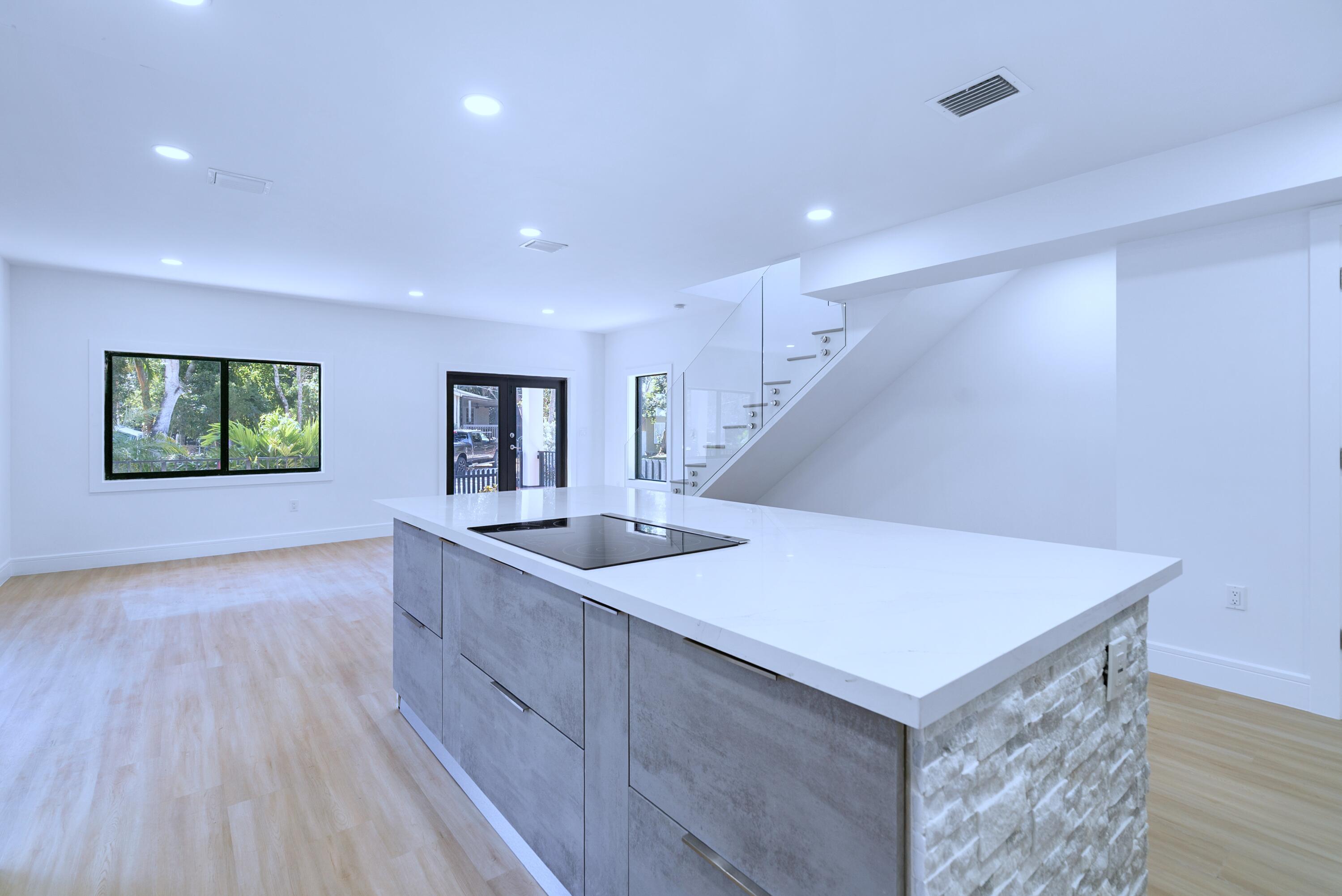 17 Coral Way Key Largo, FL 33037 - Photo 23 of 51 a view of kitchen island with sink and wooden floor