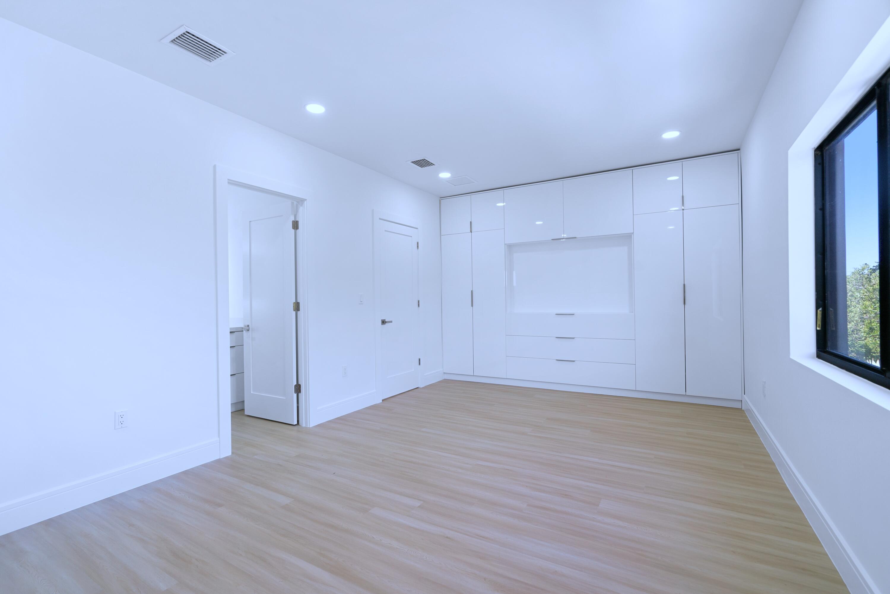 17 Coral Way Key Largo, FL 33037 - Photo 28 of 51 a view of an empty room with wooden floor and window