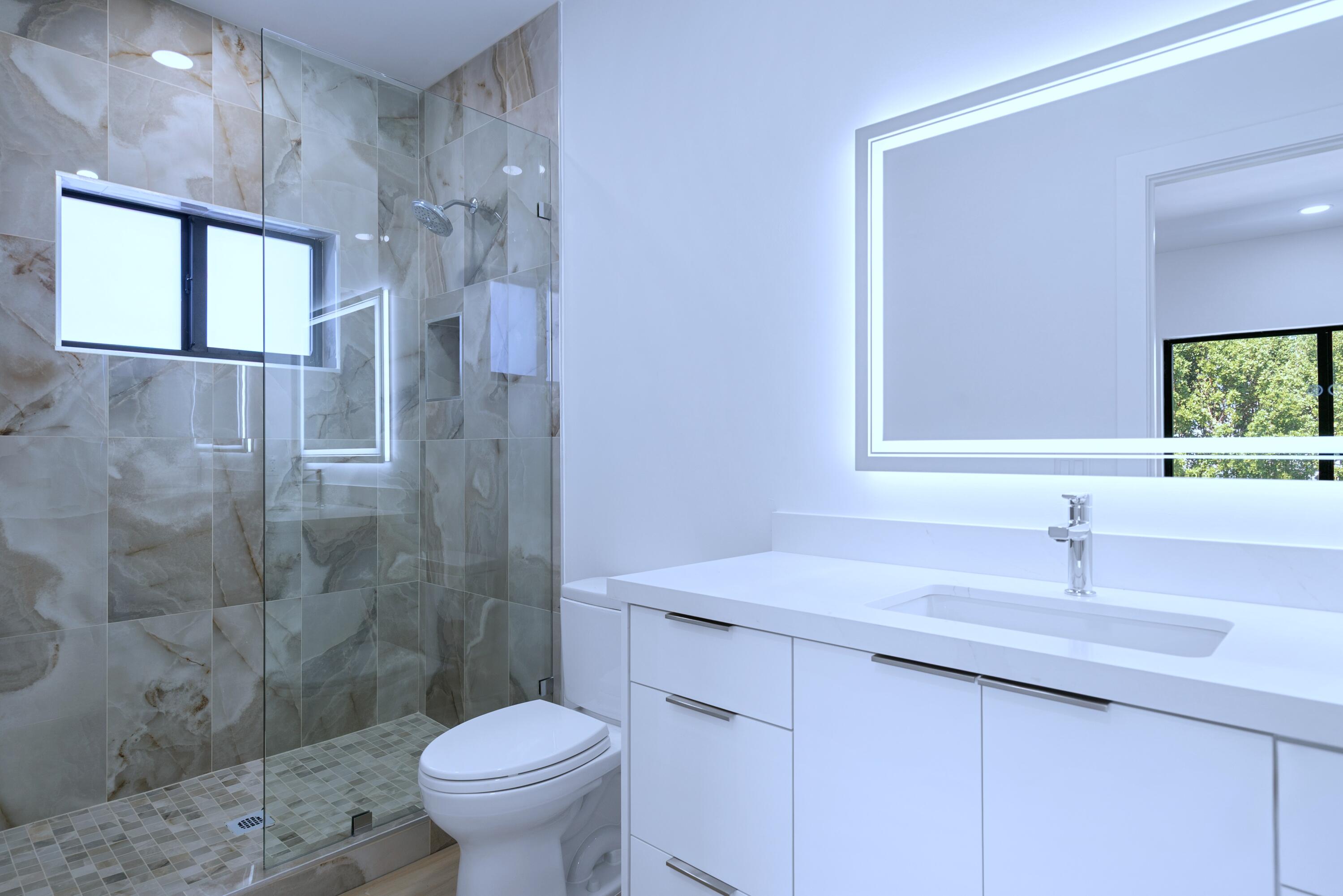 17 Coral Way Key Largo, FL 33037 - Photo 30 of 51 a bathroom with a sink toilet and shower