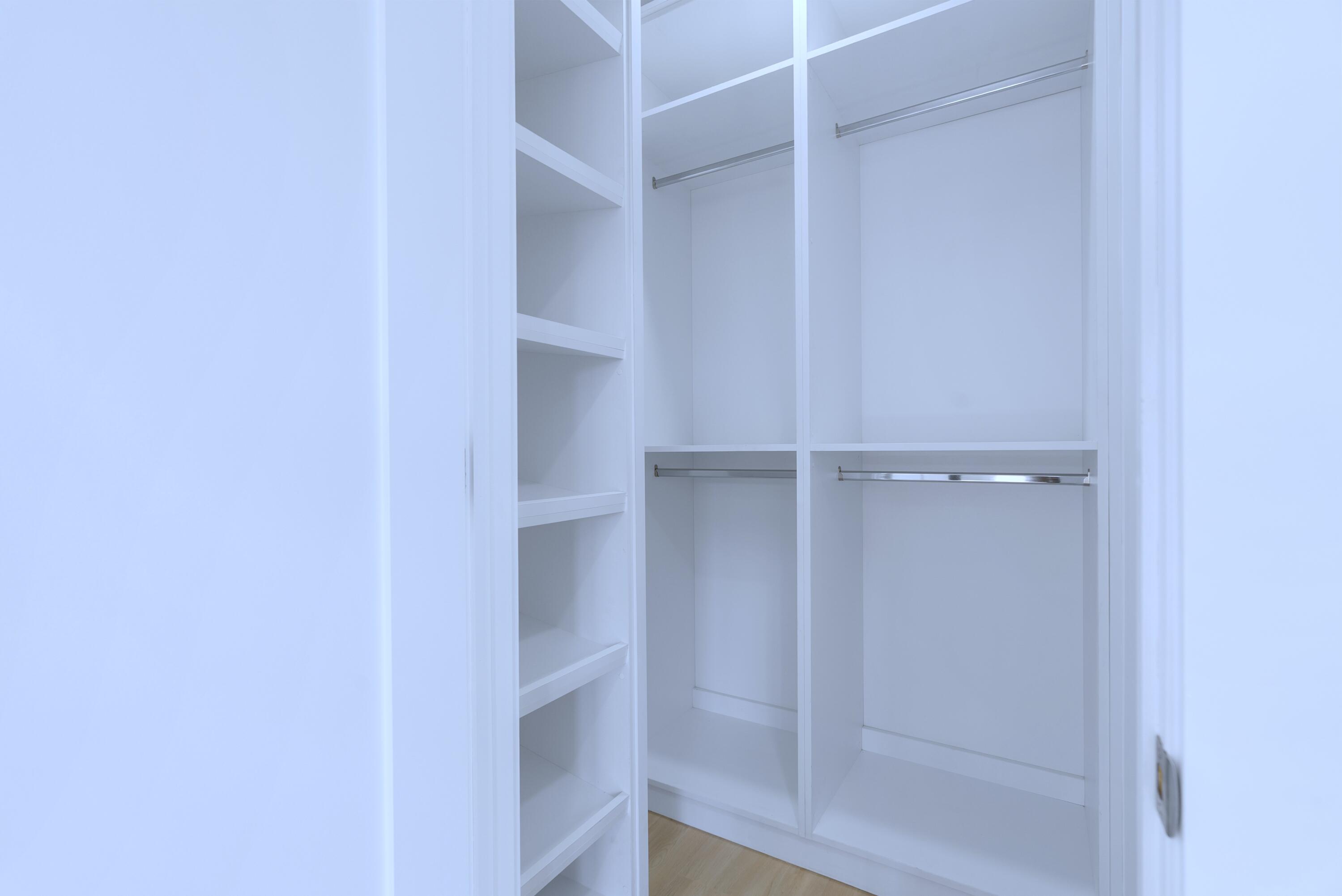 17 Coral Way Key Largo, FL 33037 - Photo 32 of 51 a view of walk in closet with empty racks